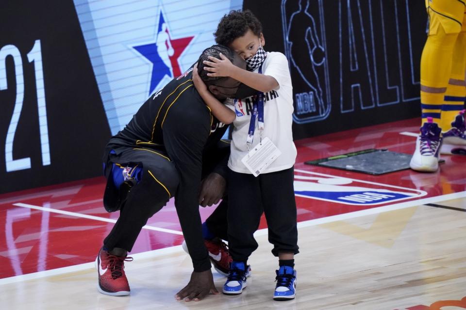 Knicks forward Julius Randle gets a hug from son Kyden.