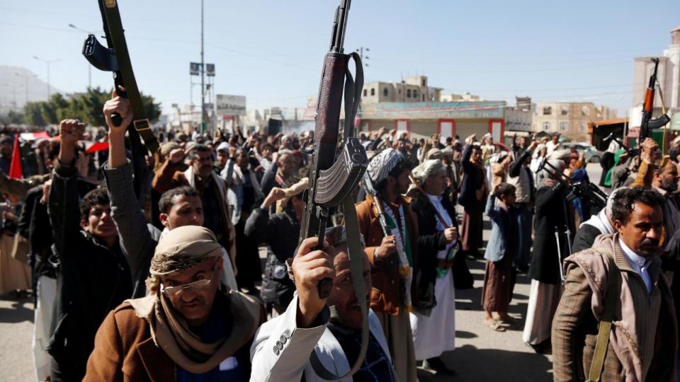 PHOTO: Yemeni protestors loyal to the Houthi movement lift their rifles as they participate in a protest held against Israel's ongoing war on Gaza Blinken's warning of a military response to rebel attacks in the Red Sea on Jan. 11, 2024 in Sanaa, Yemen. (Mohammed Hamoud/Getty Images)