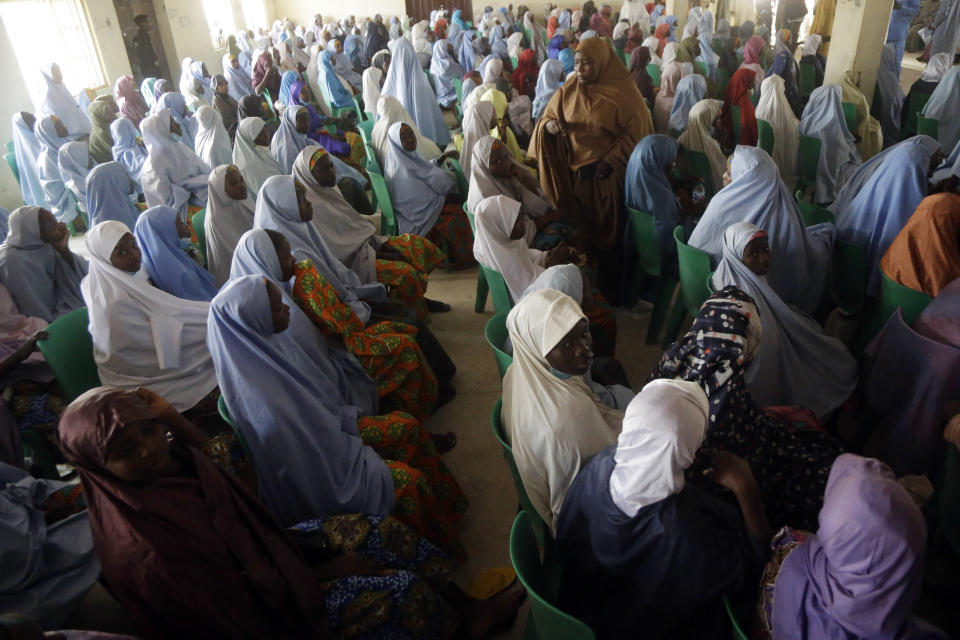 Freed school girls are seen during a reunion with their parents in Jangabe, Nigeria, Wednesday, March 3, 2021. More than 300 schoolgirls kidnapped last week in an attack on their school in northwest Nigeria have arrived in Jangabe after been freed on Tuesday. The Girls were abducted few days ago from Government Girls Secondary School in Jangabe in Zamfara state (AP Photo/Sunday Alamba)