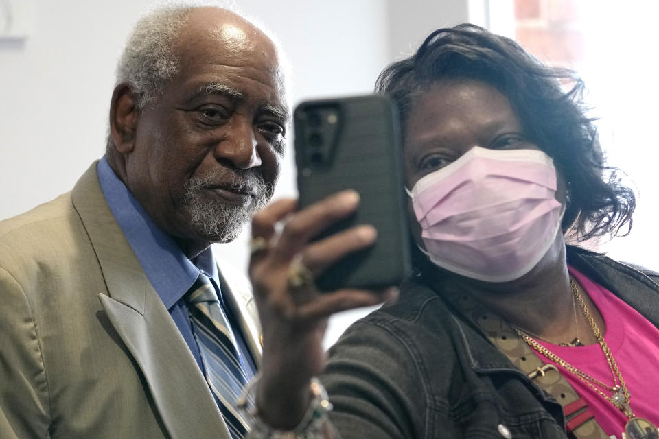 A church member, right, takes a selfie with a Congressman Danny Davis at Fellowship Baptist church in Chicago, Sunday, March 3, 2024. (AP Photo/Nam Y. Huh)