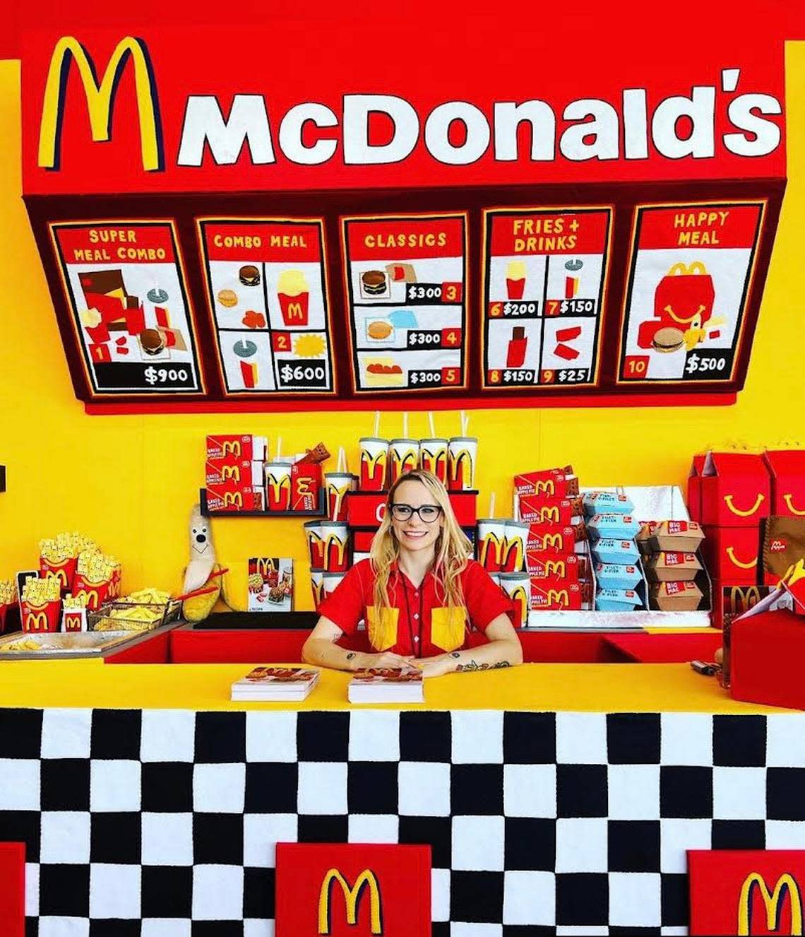 British artist Lucy Sparrow at her “MC-HAPPINESS” installation at SCOPE in Miami Beach. Sparrow made a McDonald’s entirely out of felt fabric.