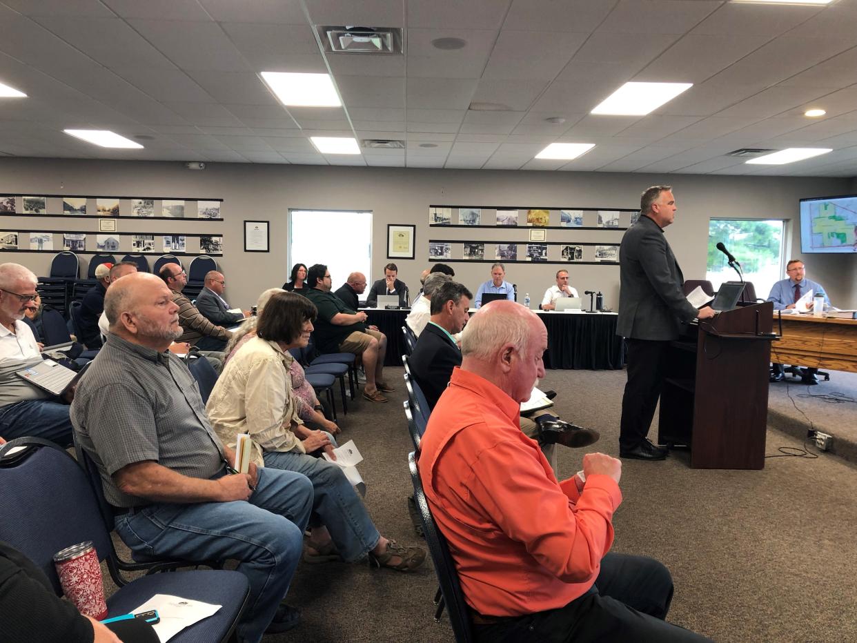 Aaron Underhill, an attorney for land use and development for The New Albany Co., speaks about a proposed 407-acre mixed-use development during the Johnstown Planning Commission Tuesday, Sept. 12.