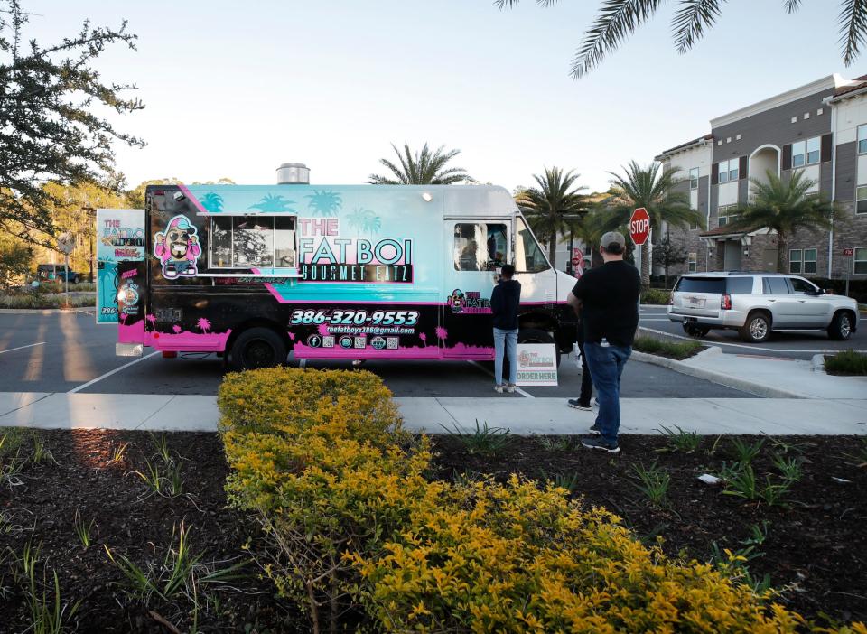 The Fat Boi Gourmet Eatz food truck sets up for a night of gourmet potatoes in New Smyrna Beach on Wednesday, Jan. 19.