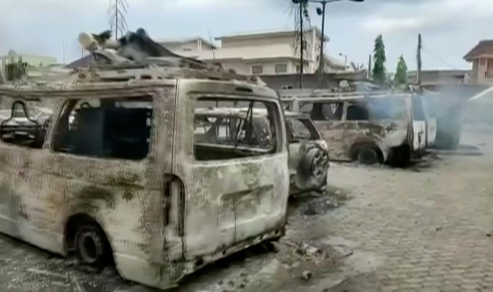 Burnt vehicles outside the TVC television station in LagosReuters TV