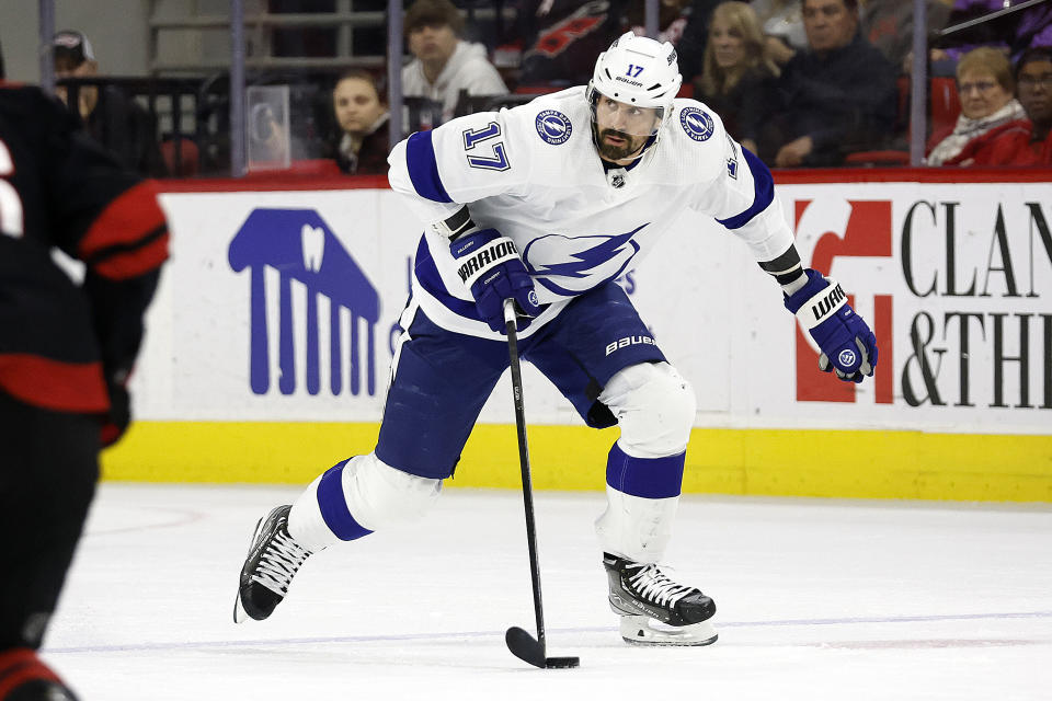 Tampa Bay Lightning's Alex Killorn (17) skates with the puck against the Carolina Hurricanes during the first period of an NHL hockey game in Raleigh, N.C., Sunday, March 5, 2023. Recent Stanley Cup champions Alex Killorn, J.T. Compher and Ivan Barbashev are among the top players to watch when NHL free agency begins Saturday. (AP Photo/Karl B DeBlaker, File)