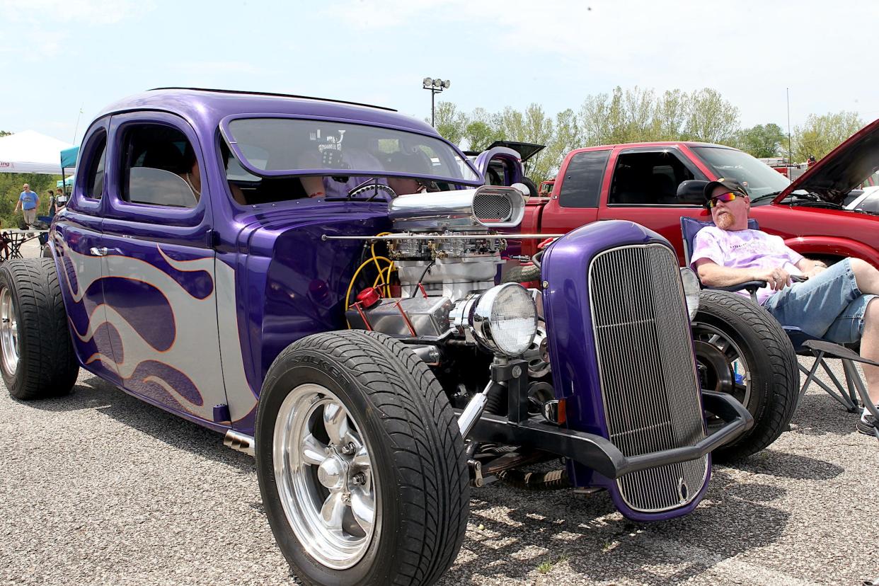 Bryan Walls sits next to his 1935 Ford at a car show hosted by the North Lawrence Career Center on Wednesday, May 8, 2024.