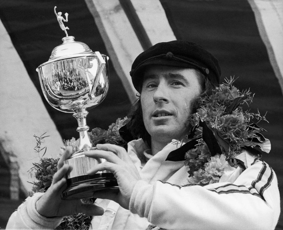 The British Driver Jackie Stewart Holds The Cup Of The Race Of Brands Hatch On March 23, 1970.