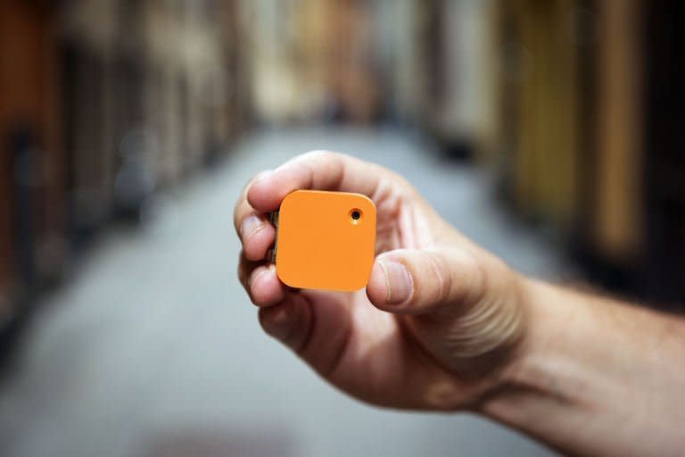 Co-founder and CEO of Swedish company Memoto, Martin Kaellstroem, shows the life-logging Memoto camera in Stockholm's old town on August 29, 2013. The Memoto camera, which resembles an iPod mini, collects a stream of pictures, automatically sorted according to the GPS-location, time and light