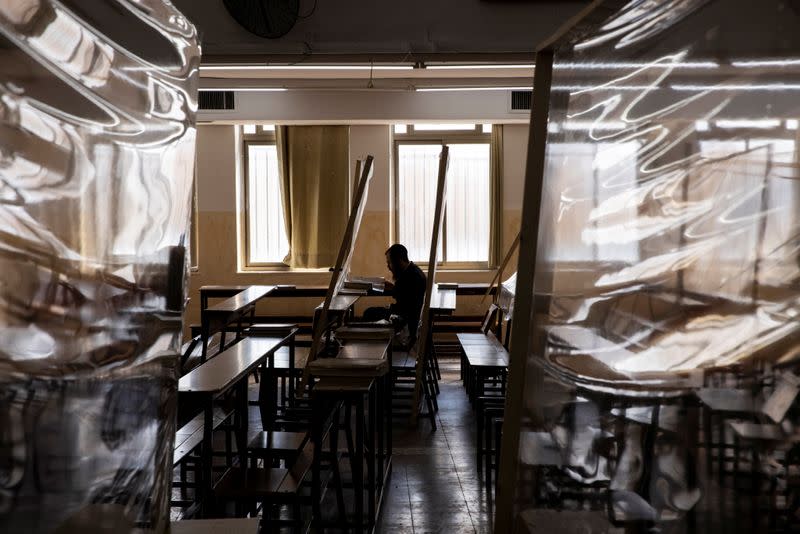 An ultra-Orthodox Jewish man studies in a Yeshiva, or Jewish seminary, equipped with partitions to protect against the spread of the coronavirus disease (COVID-19), in the Mea Shearim neighbourhood of Jerusalem