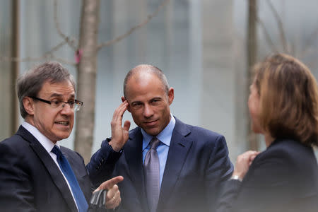 Michael Avenatti (C), attorney for Stormy Daniels, is pictured outside the Manhattan Federal Court in New York City, New York, U.S., April 13, 2018. REUTERS/Jeenah Moon
