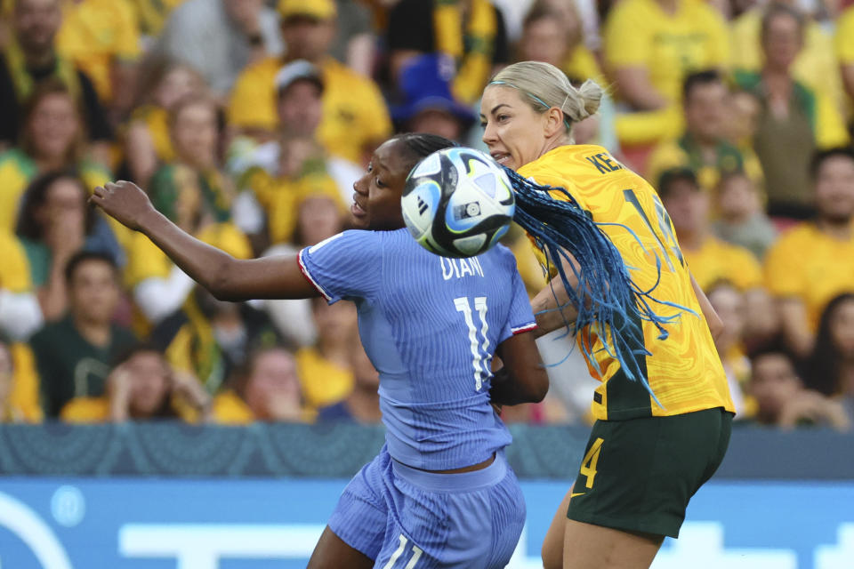 France's Kadidiatou Diani, left, challenges for the ball with Australia's Alanna Kennedy during the Women's World Cup quarterfinal soccer match between Australia and France in Brisbane, Australia, Saturday, Aug. 12, 2023. (AP Photo/Tertius Pickard)