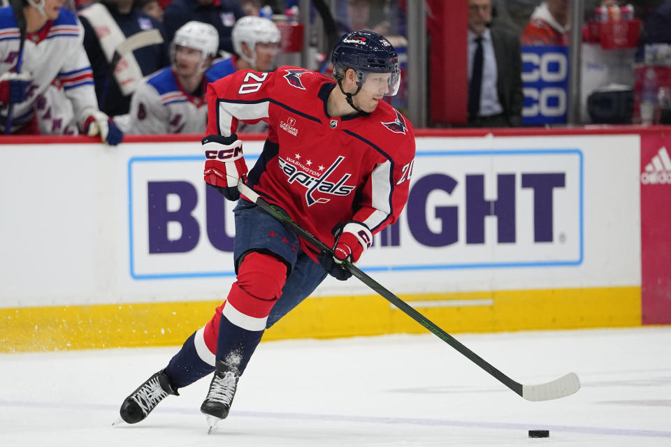 Washington Capitals center Lars Eller skates with the puck against the New York Rangers during the second period of an NHL hockey game, Saturday, Feb. 25, 2023, in Washington. (AP Photo/Julio Cortez)