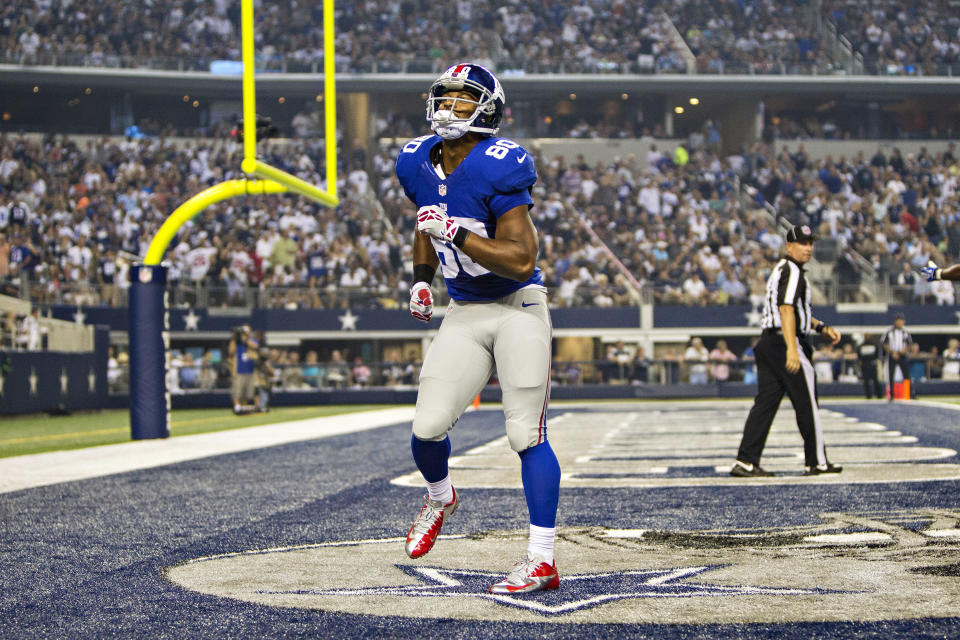 ARLINGTON, TX - 08 SEPTEMBRE: Victor Cruz # 80 des Giants de New York fait sa danse de touché contre les Cowboys de Dallas au stade AT&T le 8 septembre 2013 à Arlington, Texas.  Les Cowboys ont défait les Giants 36-31.  (Photo de Wesley Hitt/Getty Images)