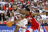Mississippi guard Matthew Murrell (11) steals the ball away from Auburn forward Johni Broome (4) during the second half of an NCAA college basketball game Saturday, Jan. 20, 2024, in Auburn, Ala. (AP Photo/Butch Dill)