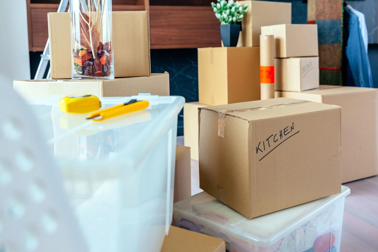 living room with moving boxes