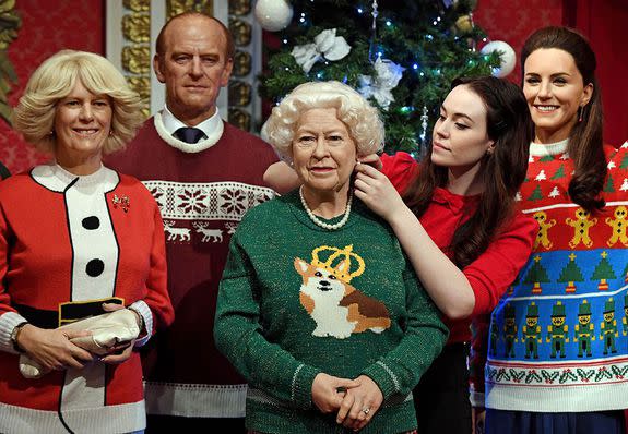 The Duchess of Cornwall in the classic tacky Santa look. (Photo: AP)