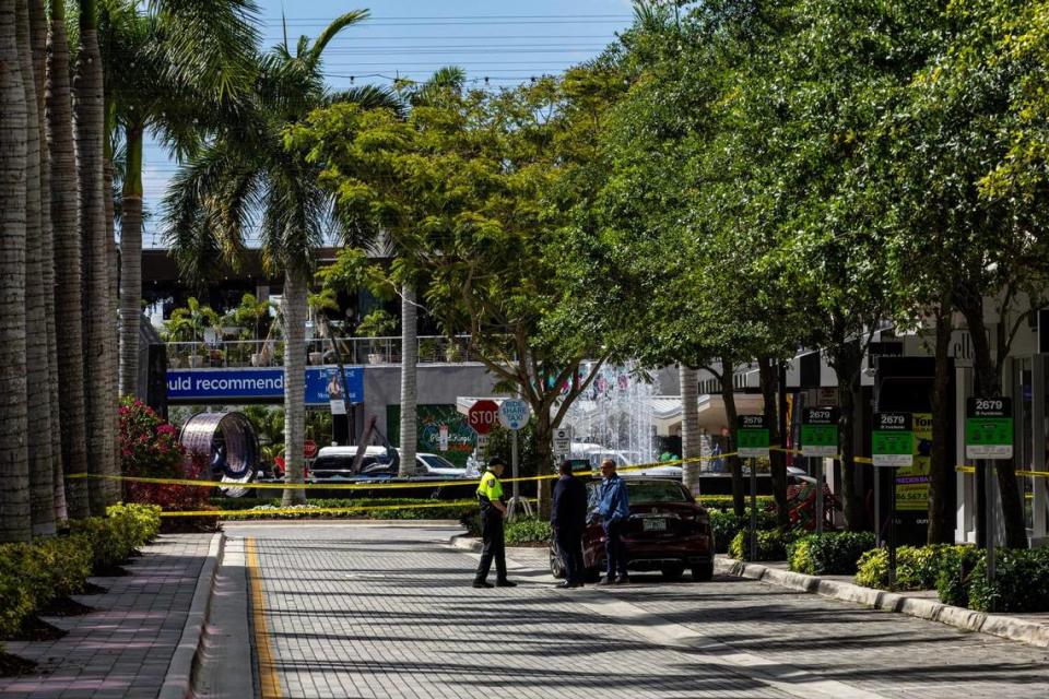 Yellow police tape hangs inside CityPlace Doral on Saturday, April 6, 2024. D.A. Varela/dvarela@miamiherald.com