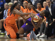 Connecticut Sun's Shekinna Stricklen, left, pressures Los Angeles Sparks' Chiney Ogwumike, right, during the second half of Game 1 of a WNBA basketball playoff game, Tuesday, Sept. 17, 2019, in Uncasville, Conn. (AP Photo/Jessica Hill)