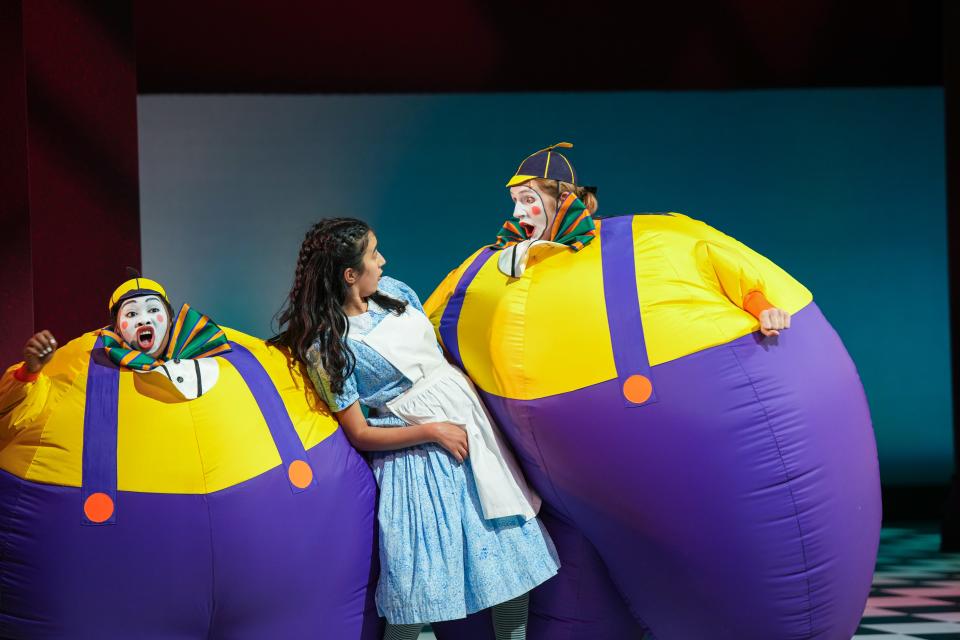 Antonisia Collins, Anja Arora, and Keegan Robinson in Children's Theatre Company's 2024 production of "Alice in Wonderland."