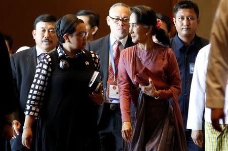 Indonesia Foreign Minister Retno Marsudi and Myanmar State Counsellor Aung San Suu Kyi walk after they attended ASEAN Foreign Minister Meeting on Rohingya issue in Sedona hotel at Yangon, Myanmar December 19 , 2016. REUTERS/Soe Zeya Tun