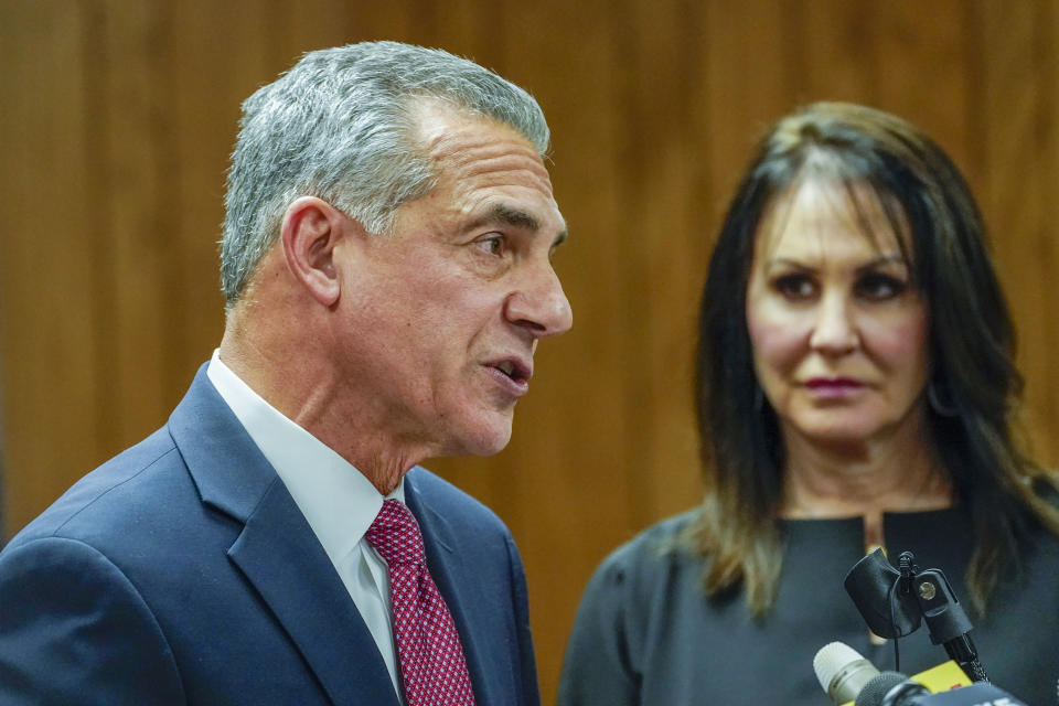 Republican gubernatorial candidate Jack Ciattarelli, left, is joined by his wife Melinda as he speaks during a news conference, Friday, Nov. 12, 2021, in Raritan, N.J. Ciattarelli conceded the race to Democratic Gov. Phil Murphy. (AP Photo/Mary Altaffer)