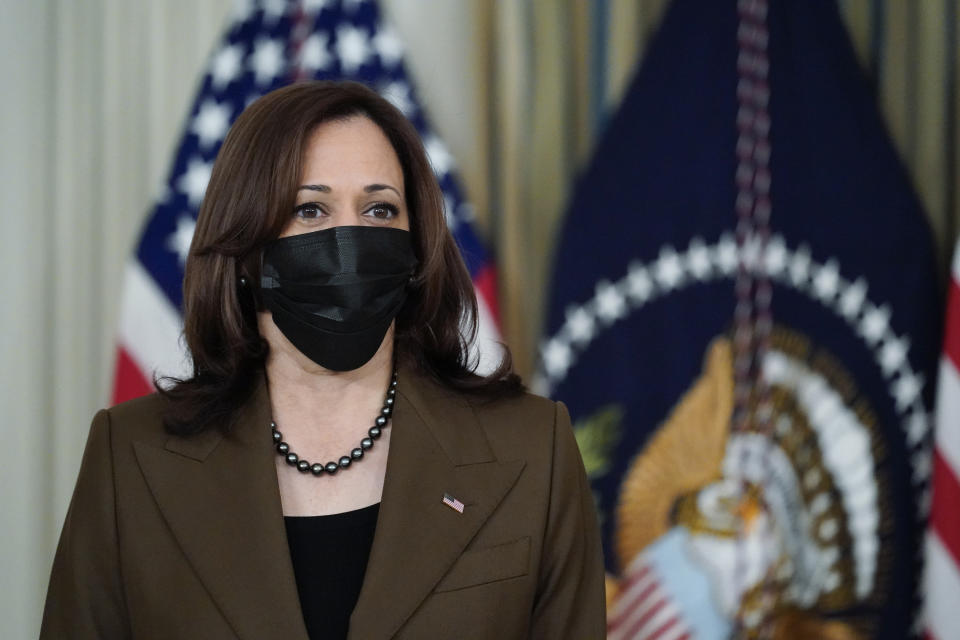 Vice President Kamala Harris listens as President Joe Biden speaks about the bipartisan infrastructure bill in the State Dinning Room of the White House, Saturday, Nov. 6, 2021, in Washington. (AP Photo/Alex Brandon)