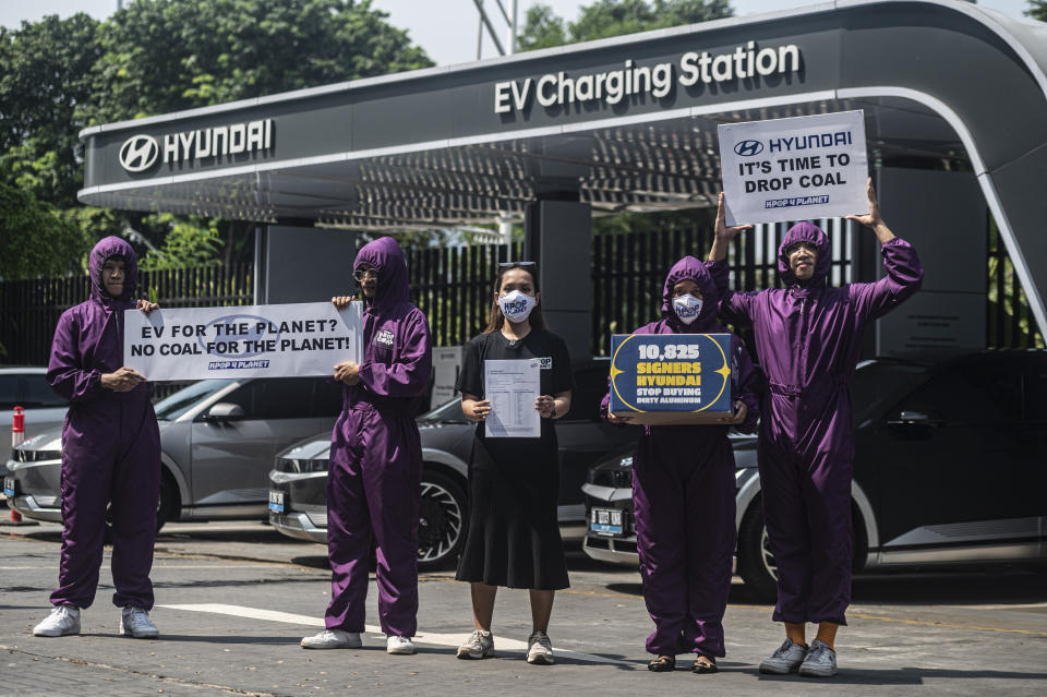 In this image provided by Kpop4Planet, members demonstrate as part of a Hyundai, Drop Coal protest outside Hyundai Motorstudio Senayan Park in Jakarta, May 2023. The demonstration was in protest of Hyundai’s agreement to buy aluminum from an industrial park at least partially powered by newly built coal plants. Fans of Korean pop bands around the world are increasingly channeling their millions-strong online community into climate and environmental activism. (Kpop4Planet via AP)