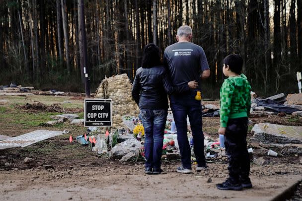 PHOTO: Family members of environmental activist Manuel Teran visit a makeshift memorial for Teran, who was allegedly shot by police during a raid to clear the construction site of a police training facility near Atlanta, on Feb. 6, 2023. (Cheney Orr/AFP via Getty Images, FILE)