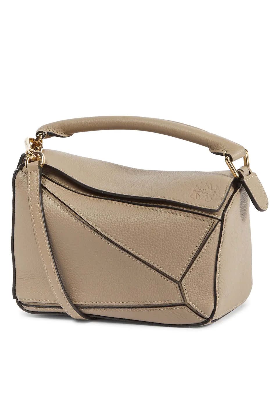 <p><a class="link " href="https://www.mytheresa.com/en-gb/loewe-puzzle-mini-leather-shoulder-bag-1852708.html" rel="nofollow noopener" target="_blank" data-ylk="slk:SHOP NOW;elm:context_link;itc:0;sec:content-canvas">SHOP NOW</a></p><p>Loewe's Puzzle bag comes in a huge variety of colours and sizes, including this small, textured design in sand, which would be a lovely addition to any woman's wardrobe.</p><p>Leather bag, £1,500, Loewe at <a href="https://www.mytheresa.com/en-gb/loewe-puzzle-mini-leather-shoulder-bag-1852708.html" rel="nofollow noopener" target="_blank" data-ylk="slk:Mytheresa;elm:context_link;itc:0;sec:content-canvas" class="link ">Mytheresa</a></p>