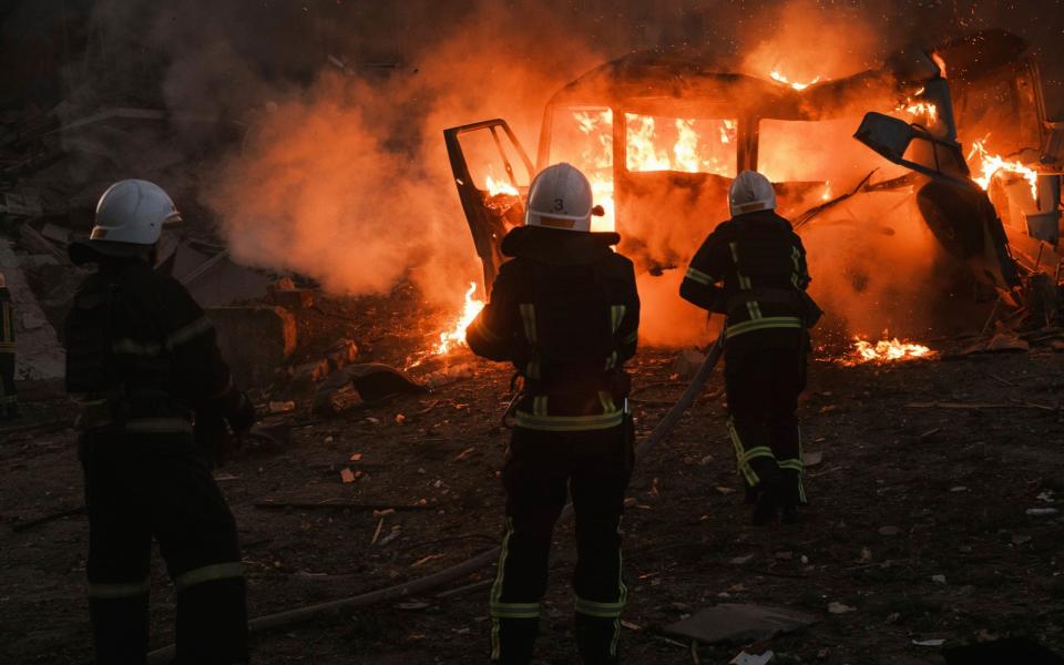 Firefighters work at the site of a fire after Russian shelling in Mykolaiv, Ukraine - AP Photo/George Ivanchenko