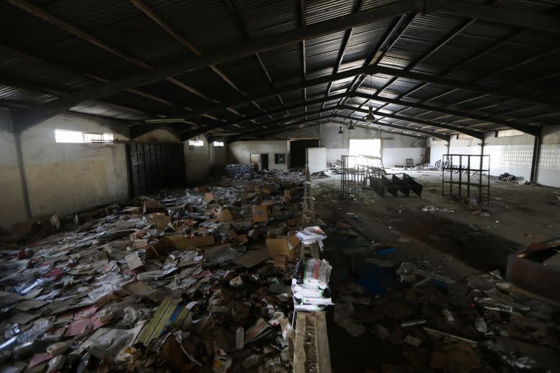 Damaged items left behind at the NEMA warehouse are seen on the ground in Abuja