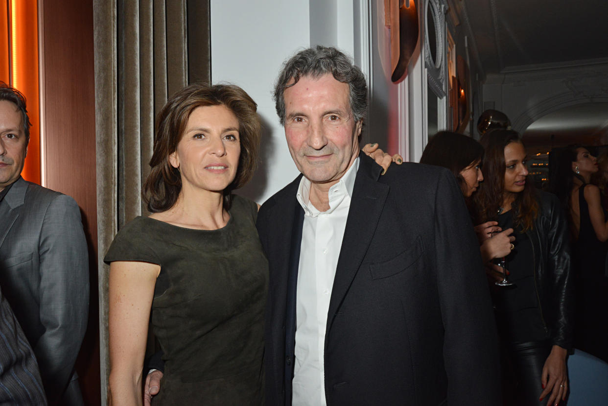 PARIS, FRANCE - MARCH 20:  Jean Jacques Bourdin (R) and his wife Anne Nivat attend the 'Neo Burlesque Party' during the Hotel Vernet Opening Cocktail At Hotel Vernet on March 20, 2014 in Paris, France.  (Photo by Foc Kan/WireImage)