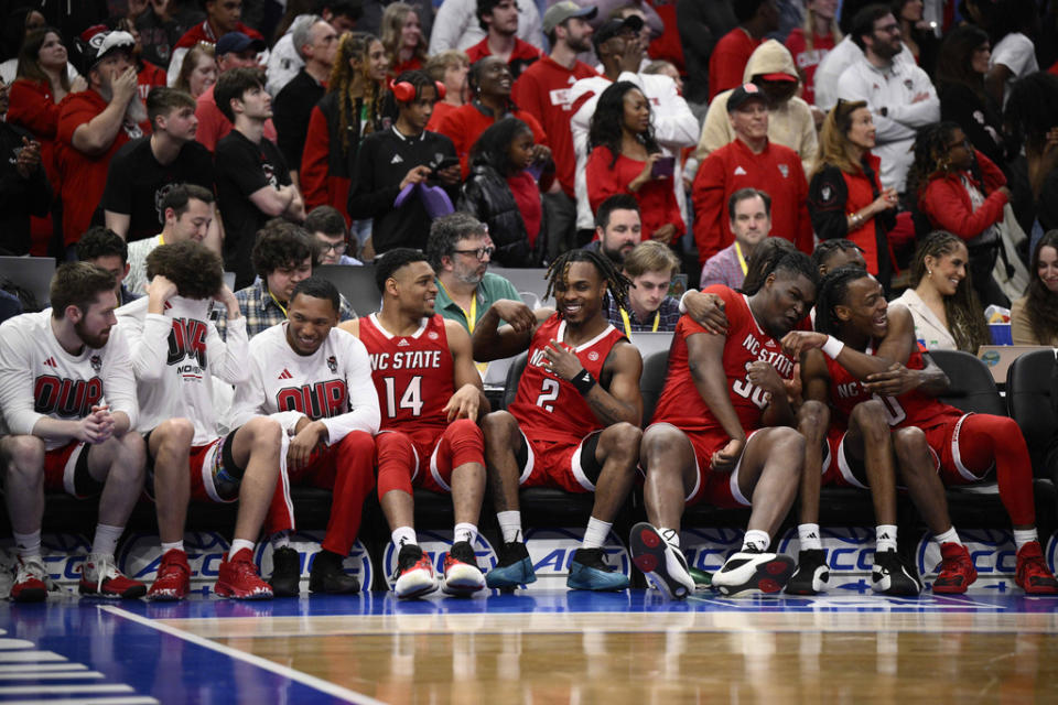 North Carolina State player celebrating on the bench in the final minute of the second half of an NCAA college basketball game against North Carolina in the championship of the Atlantic Coast Conference tournament, Saturday, March 16, 2024, in Washington. (AP Photo/Nick Wass)