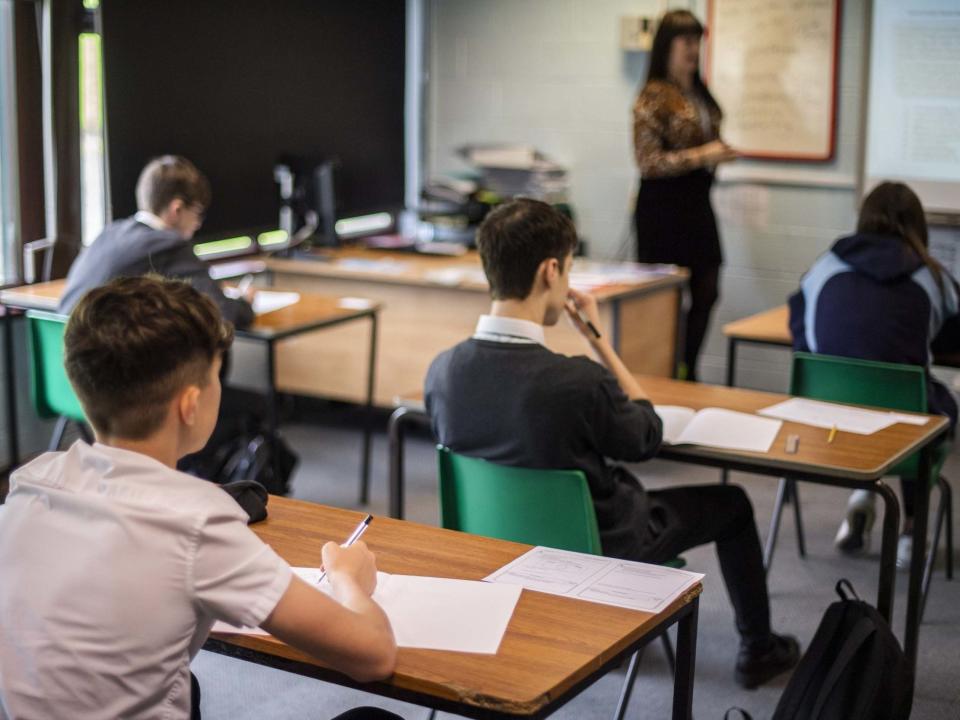 Pupils sit apart during a socially distanced language lesson at Longdendale High School: Getty Images