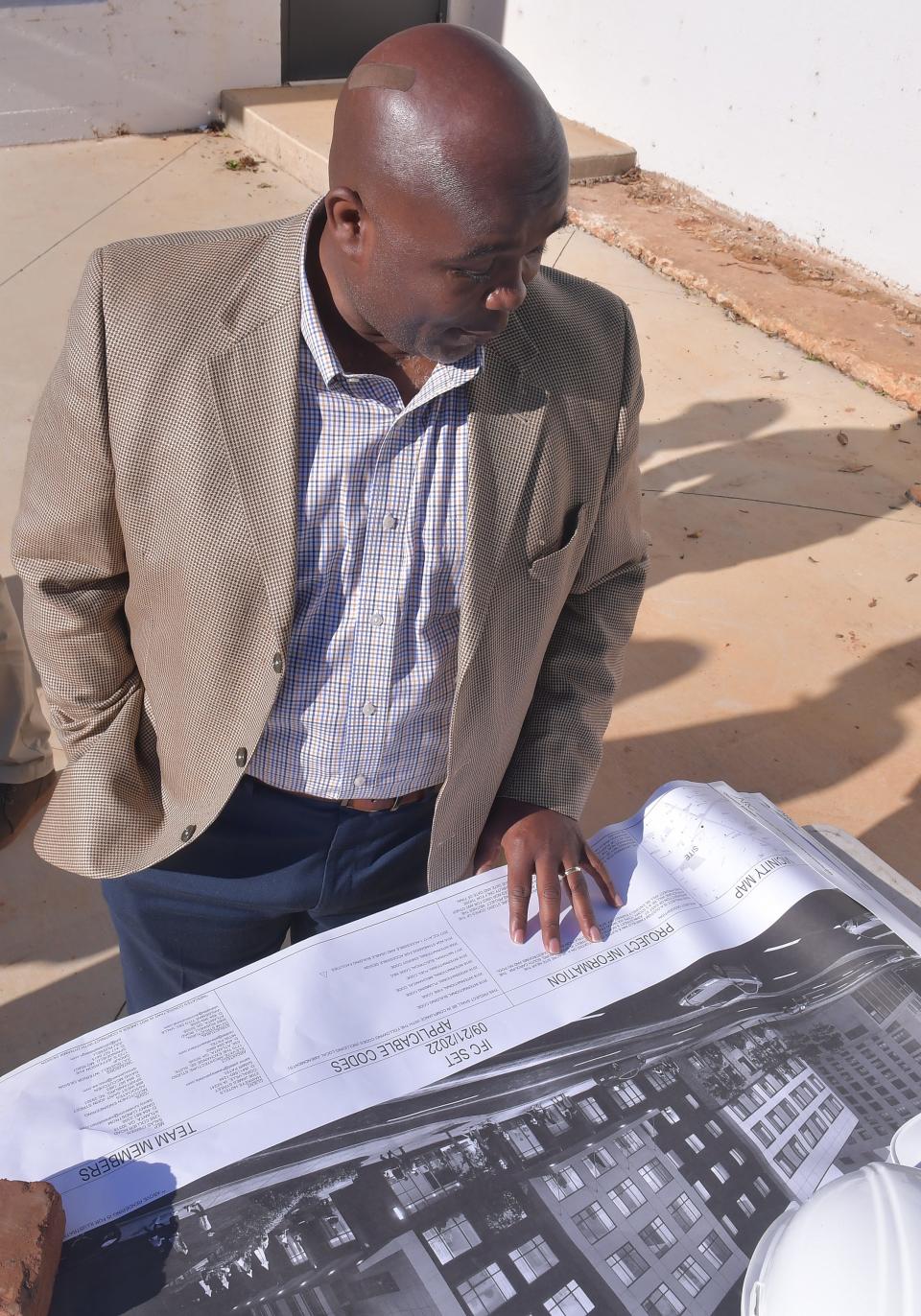 A groundbreaking was held for the new Fairfield Inn & Suites hotel in Spartanburg on Dec. 18, 2023. The new hotel will be on St. John Street next to the Montgomery Building. Spartanburg Mayor Jerome Rice looks over plans for the project and how it will look in the downtown Spartanburg area.