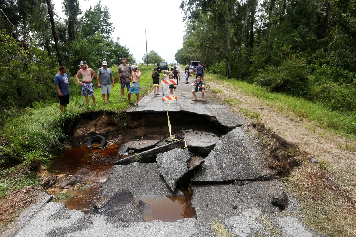 A large sinkhole opened up on Grange Fall Loop in Wimauma, Florida (Reuters)