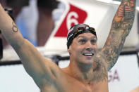 Caeleb Dressel of the United States celebrates winning the men's 100-meter freestyle final at the 2020 Summer Olympics, Thursday, July 29, 2021, in Tokyo, Japan. (AP Photo/Matthias Schrader)