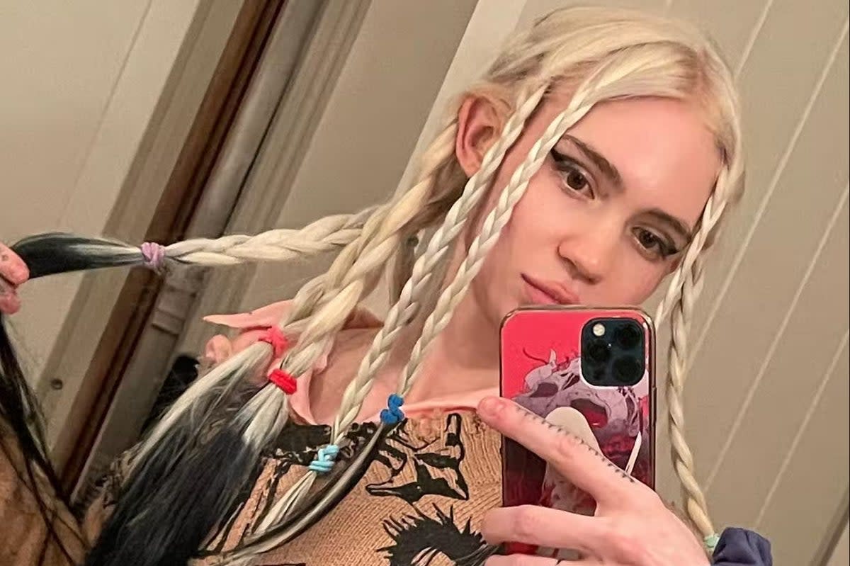 Grimes shows off her elf ears  (Grimes via Instagram)