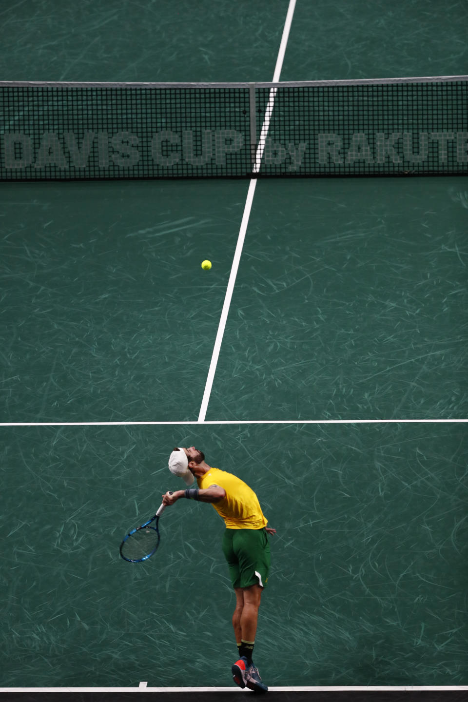 Australia's Jordan Thompson serves to Netherland's Tallon Griekspoor during a Davis Cup quarter-final tennis match between Australia and The Netherlands in Malaga, Spain, Tuesday, Nov. 22, 2022. (AP Photo/Joan Monfort)