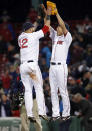 Boston Red Sox closer Koji Uehara, right, celebrates with first baseman Mike Napoli after the Red Sox defeated the New York Yankees 5-1 in a baseball game at Fenway Park in Boston, Wednesday, April 23, 2014. (AP Photo/Elise Amendola)