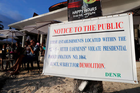 A government violation notice is pictured in front of an establishment that is due for demolition in Boracay in Philippines, April 8, 2018. REUTERS/Erik De Castro