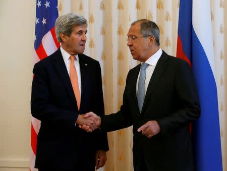 Russian Foreign Minister Sergei Lavrov (R) shakes hands with U.S. Secretary of State John Kerry during a meeting in Moscow, Russia, July 15, 2016. REUTERS/Sergei Karpukhin