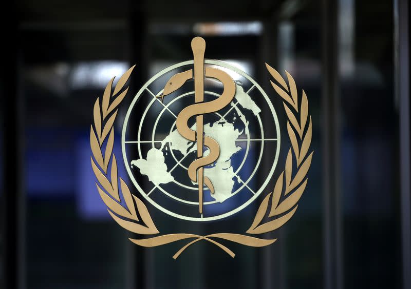 FILE PHOTO: FILE PHOTO: A logo is pictured on the headquarters of the WHO in Geneva
