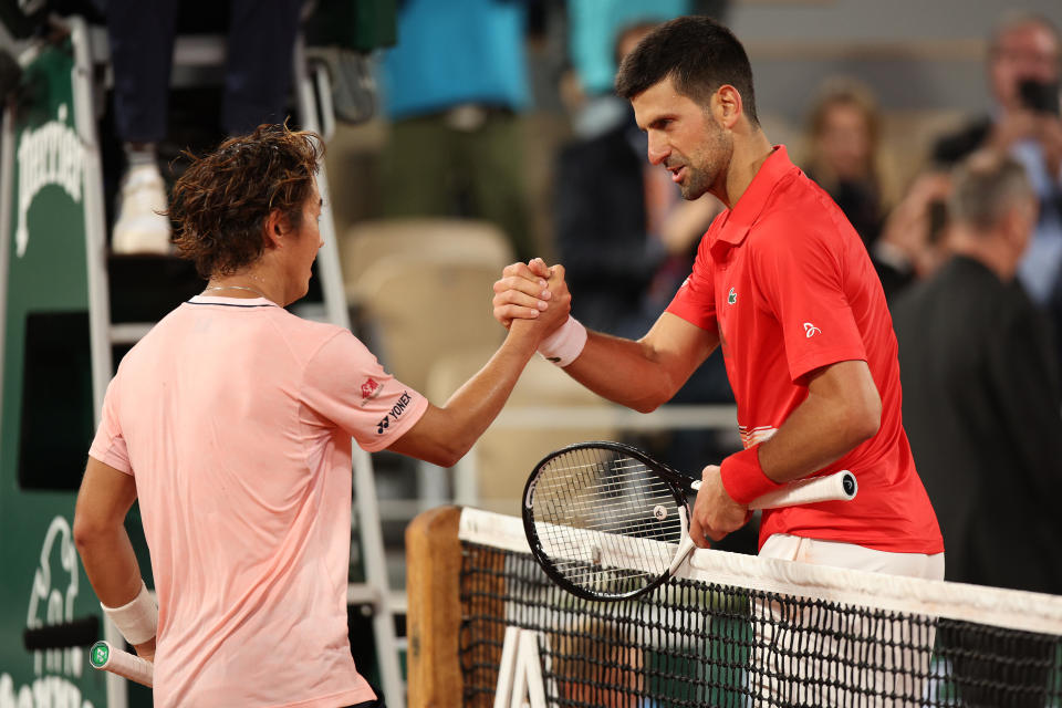 Novak Djokovic and Yoshihito Nishioka, pictured here after their match at the French Open.