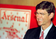 FILE PHOTO: French manager Arsene Wenger smiles during a press conference after becoming manager of Arsenal football club September 22, 1996. Action Images via Reuters/Ian Waldie/File Photo