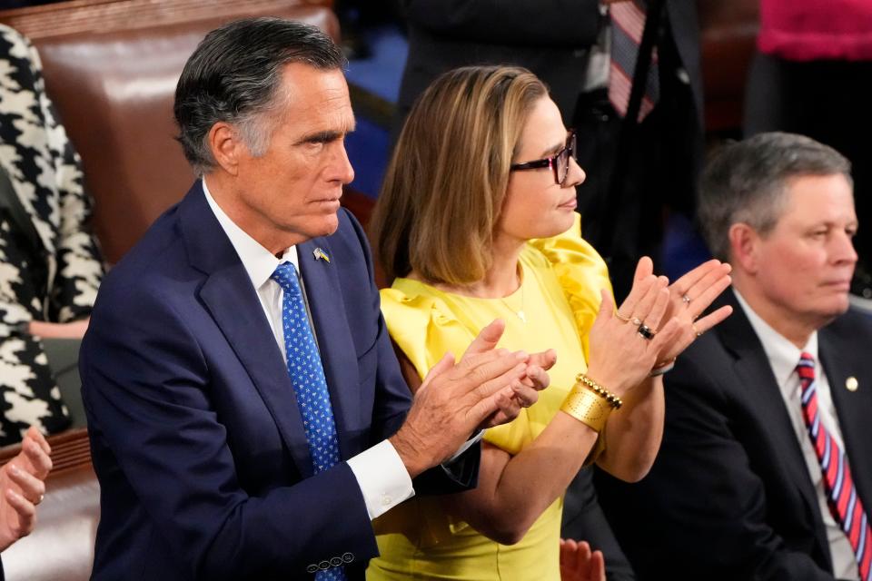 Sen. Mitt Romney, R-UT, and Kyrsten Sinema, I-Ariz., listen to President Joe Biden during the State of the Union address from the House chamber of the United States Capitol in Washington on Feb 7, 2023.