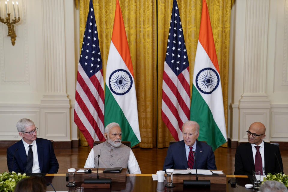 President Joe Biden speaks during a meeting with India's Prime Minister Narendra Modi and American and Indian business leaders in the East Room of the White House, Friday, June 23, 2023, in Washington. From left, Tim Cook, CEO of Apple, Modi, Biden, and Satya Nadella, CEO of Microsoft. (AP Photo/Evan Vucci)
