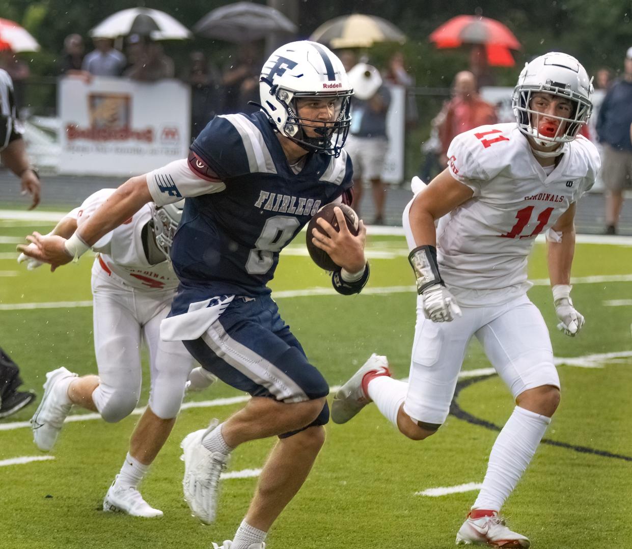 Fairless' Carson Colucci outruns Sandy Valley defenders Luke Williams and Troy Snyder (11) to score a second-quarter touchdown, Thursday, Aug. 17, 2023.