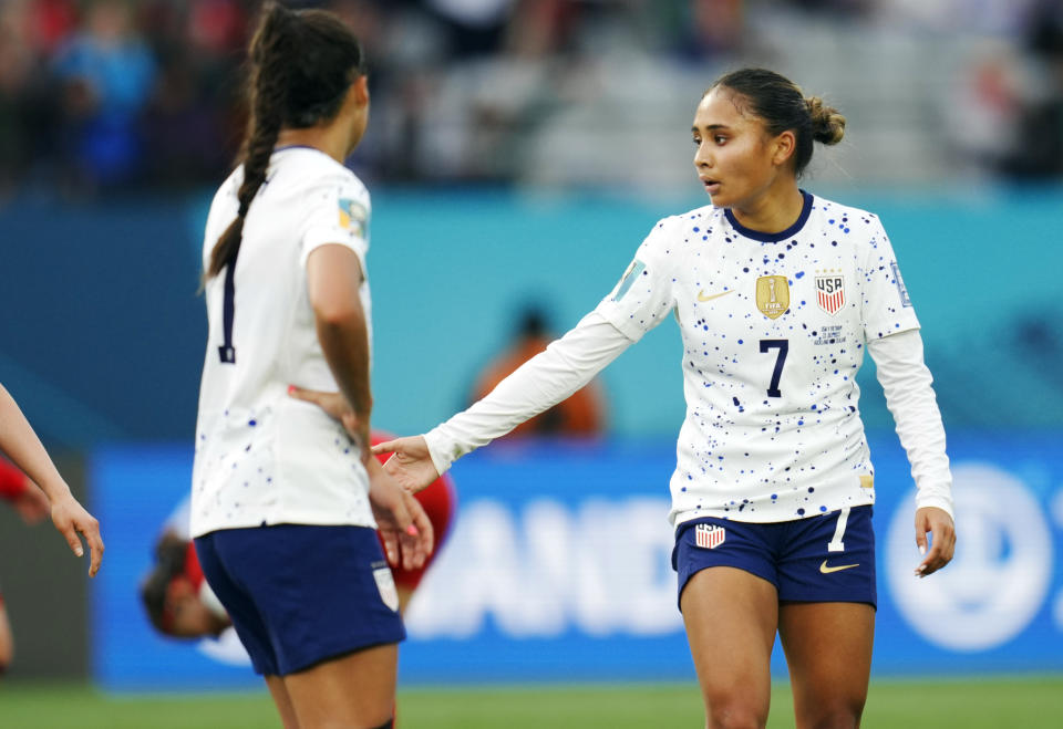 United States' Alyssa Thompson (7) and Sophia Smith (11) react after the Women's World Cup Group E soccer match between the United States and Vietnam at Eden Park in Auckland, New Zealand, Saturday, July 22, 2023. (AP Photo/Abbie Parr)