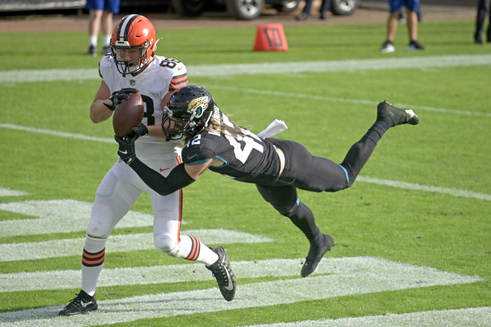 FILE - In this Sunday, Nov. 29, 2020 file photo, Jacksonville Jaguars safety Andrew Wingard (42) breaks up a pass intended for Cleveland Browns tight end Harrison Bryant (88) during the second half of an NFL football game in Jacksonville, Fla. The Cleveland Browns added starting safety Andrew Sendejo and rookie tight end Harrison Bryant to their lengthy COVID-19 list, Tuesday, Dec. 29, 2020.(AP Photo/Phelan M. Ebenhack, File)